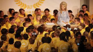 Gwen speaking with children